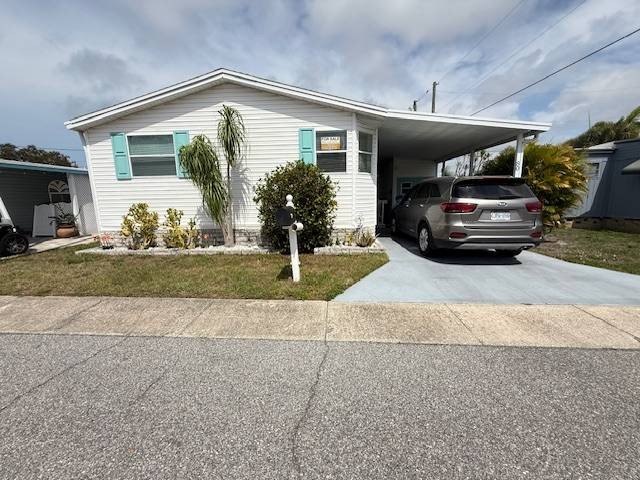 Welcome to this immaculately kept, turn-key lakefront home in - Beach Home for sale in Dunedin, Florida on Beachhouse.com