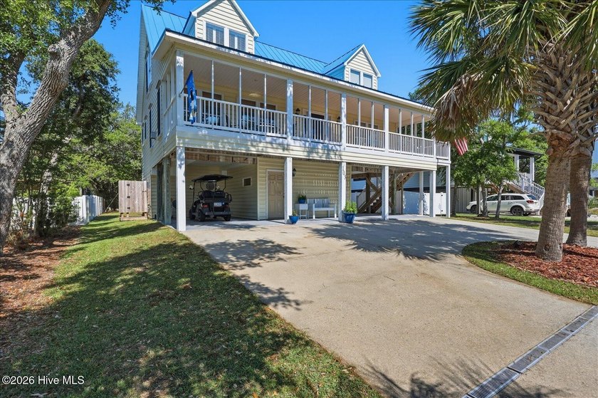 Just a short stroll from the beach, this classic Cape Cod-style - Beach Home for sale in Oak Island, North Carolina on Beachhouse.com