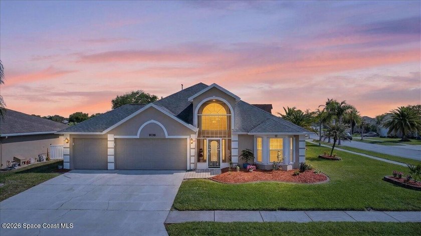 This beautifully maintained 4-bedroom, 3-car garage home offers - Beach Home for sale in Melbourne, Florida on Beachhouse.com