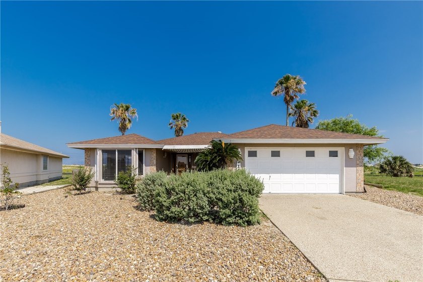 Located on a quiet street in Padre Island, this spacious - Beach Home for sale in Corpus Christi, Texas on Beachhouse.com