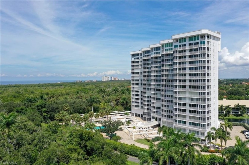 Nestled in the highly sought after 01 stack, this rare end-unit - Beach Home for sale in Naples, Florida on Beachhouse.com