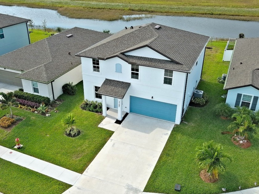 Experience lakefront living in this exclusive two-story home - Beach Home for sale in Fort Pierce, Florida on Beachhouse.com