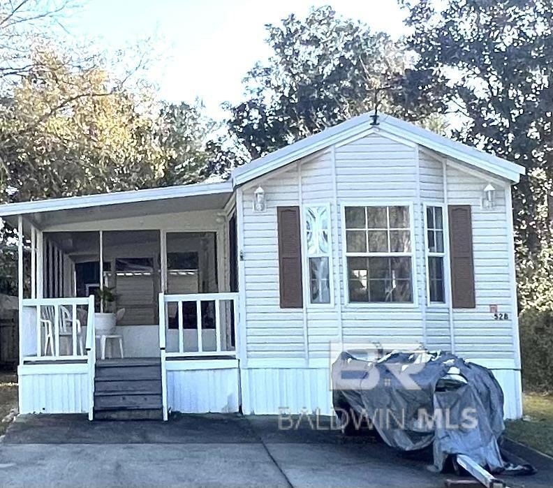 Nestled on a quiet cul-de-sac, this adorable one-bedroom - Beach Home for sale in Lillian, Alabama on Beachhouse.com