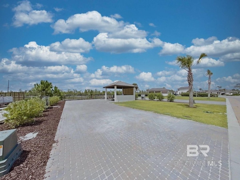 Site 63 boasts an expansive lot adorned with an extended paver - Beach Lot for sale in Orange Beach, Alabama on Beachhouse.com