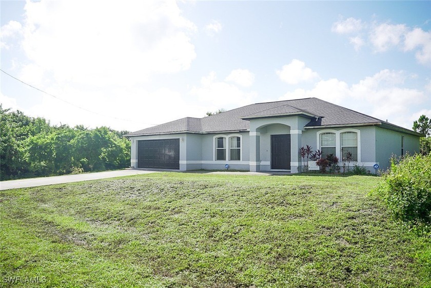 This wonderful home features a spacious family-room, living room - Beach Home for sale in Lehigh Acres, Florida on Beachhouse.com