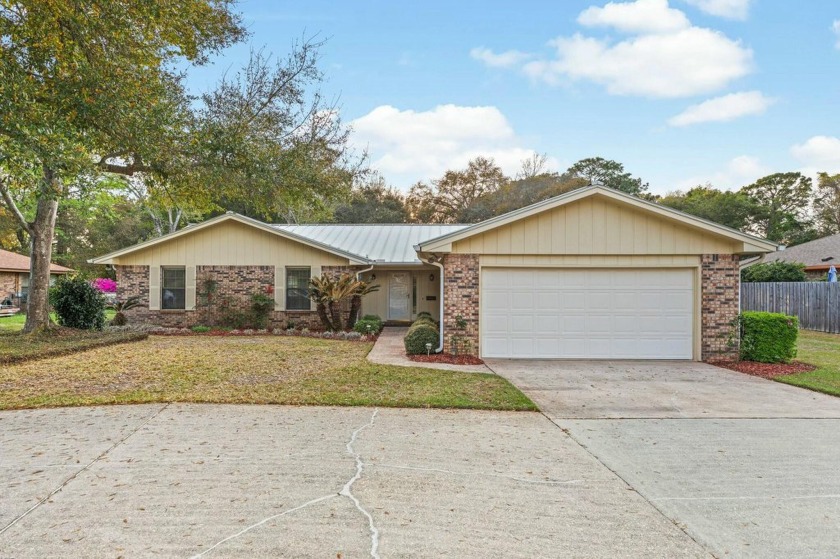 Get ready to call this spacious, golf course home with a covered - Beach Home for sale in Shalimar, Florida on Beachhouse.com