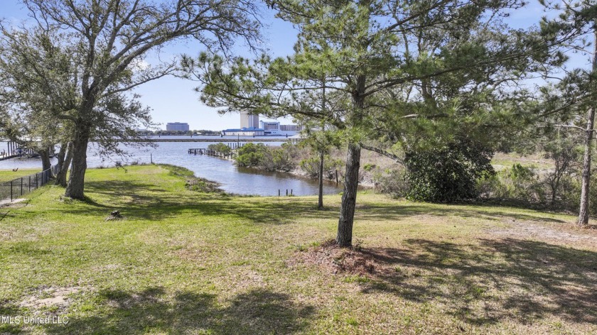 Stretched on 1.46 acres along Fournier near Racetrack Rd., this - Beach Lot for sale in D Iberville, Mississippi on Beachhouse.com