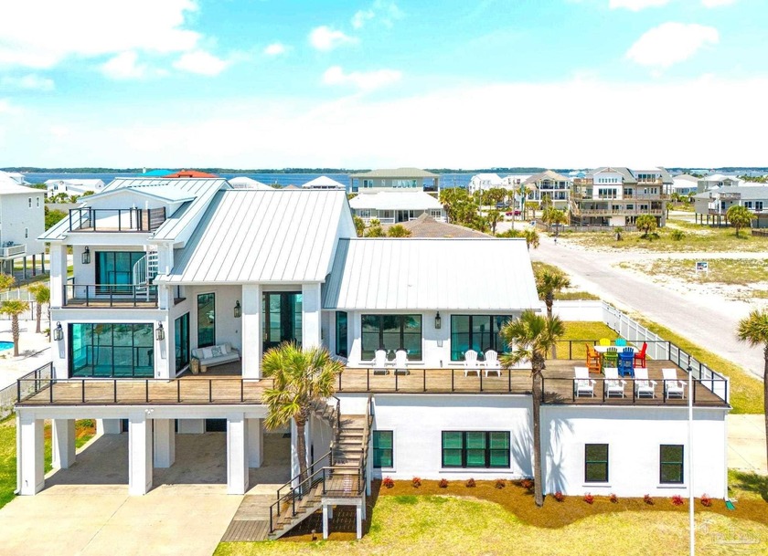 Experience luxury living next to the Gulf of Mexico in this - Beach Home for sale in Pensacola Beach, Florida on Beachhouse.com