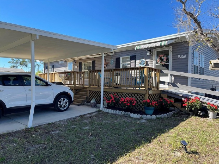 This adorable three-bedroom two-bath manufactured home is ready - Beach Home for sale in Hudson, Florida on Beachhouse.com