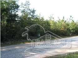 Lovely wooded lot on entrance  to lakefront community....this is - Beach Lot for sale in Milton, Florida on Beachhouse.com