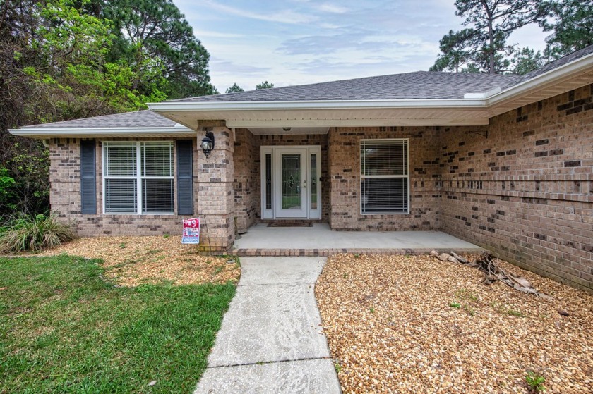 Welcome to Your Florida Dream Home featuring a Pool, Porch & - Beach Home for sale in Navarre, Florida on Beachhouse.com