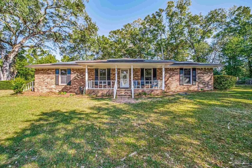 Welcome to this charming 4-bedroom, 2-bath brick home offering 2 - Beach Home for sale in Pace, Florida on Beachhouse.com
