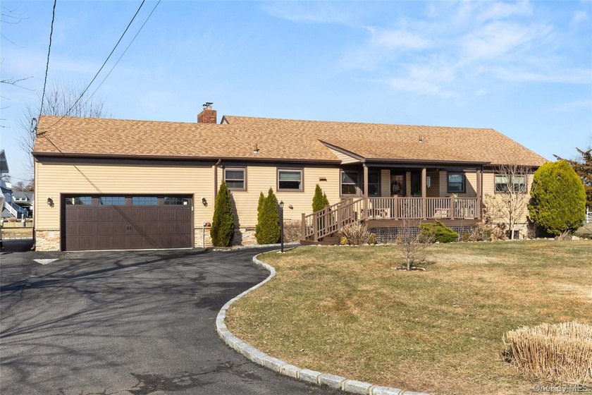 Welcome to this immaculate three-bedroom ranch, perfectly tucked - Beach Home for sale in Bay Shore, New York on Beachhouse.com