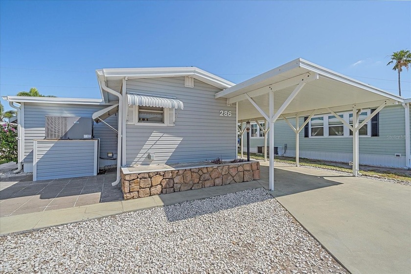 WATERFRONT LIVING in TROPIC ISLES - 55+ RESIDENT-OWNED community - Beach Home for sale in Palmetto, Florida on Beachhouse.com