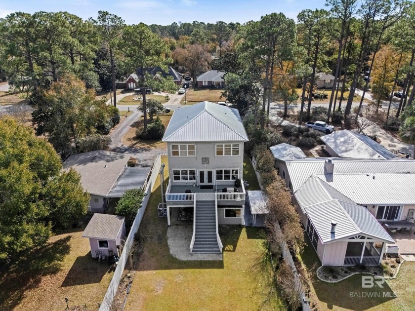 Don't miss this beautiful waterfront home that sits directly on - Beach Home for sale in Gulf Shores, Alabama on Beachhouse.com