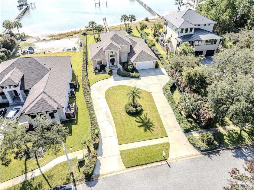 This beautiful waterfront home is perfectly located along - Beach Home for sale in Navarre, Florida on Beachhouse.com