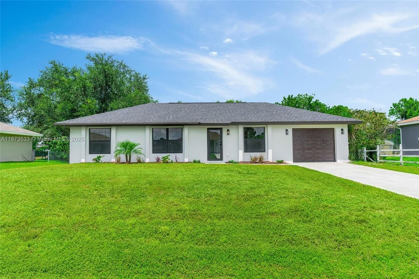 MOTIVATED SELLER!!! A stunning fully renovated home featuring 3 - Beach Home for sale in Lehigh Acres, Florida on Beachhouse.com