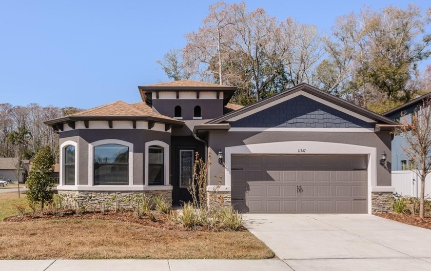 Welcome home to 11347 Weaver Hollow, nestled inside the - Beach Home for sale in New Port Richey, Florida on Beachhouse.com