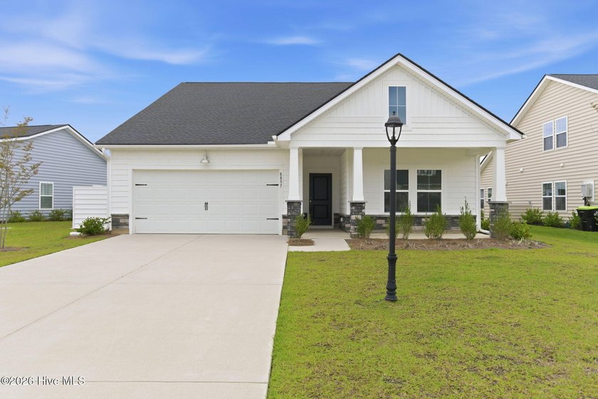 Experience elevated coastal living at 8857 Baton Rouge in the - Beach Home for sale in Calabash, North Carolina on Beachhouse.com
