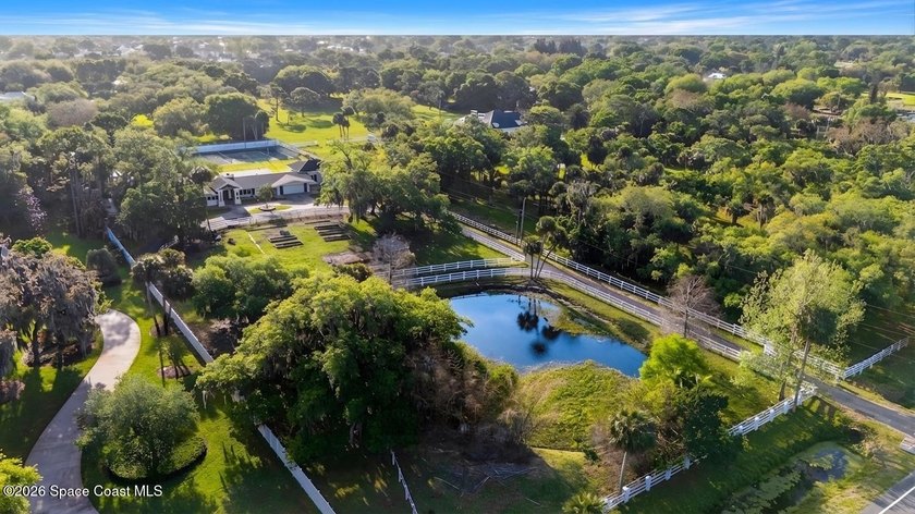 Set on nearly three picturesque acres beneath a canopy of - Beach Home for sale in Melbourne, Florida on Beachhouse.com