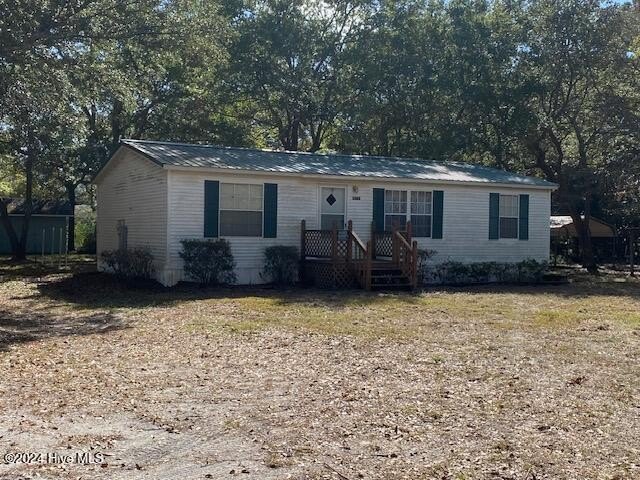 Doublewide with metal roof, quiet neighborhood, carport and shed - Beach Home for sale in Shallotte, North Carolina on Beachhouse.com