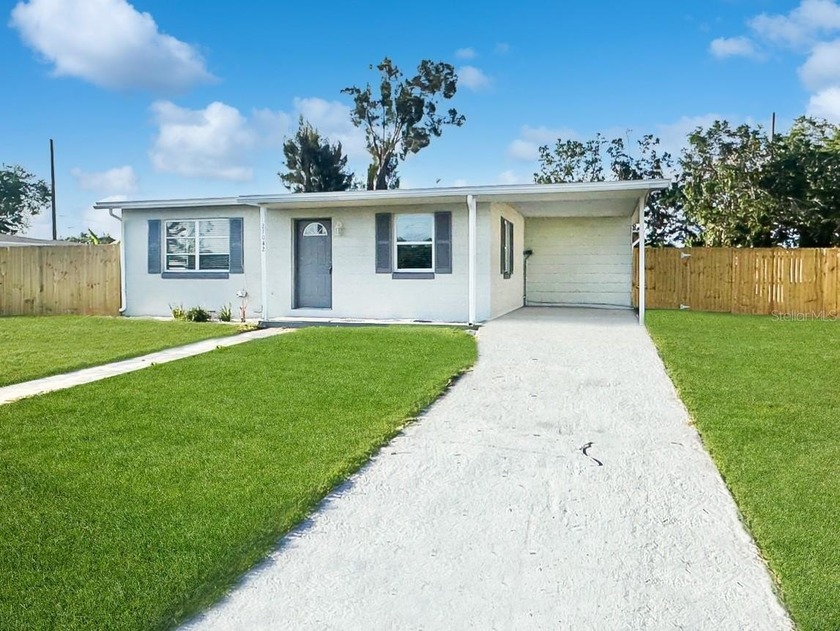 Step into this beautifully updated 4-bedroom, 2-bathroom home - Beach Home for sale in Port Charlotte, Florida on Beachhouse.com