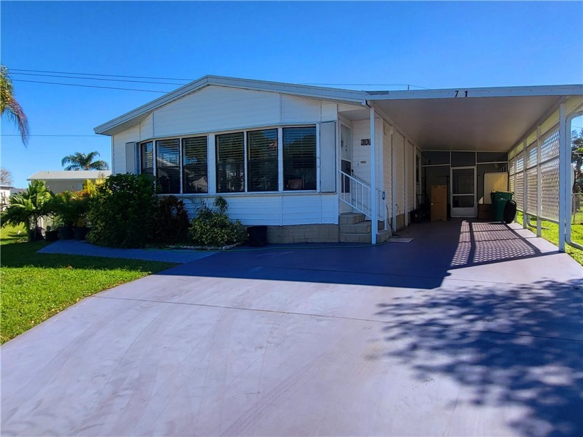 The home is located in a cul-de-sac, with 1444 living square - Beach Home for sale in Barefoot Bay, Florida on Beachhouse.com