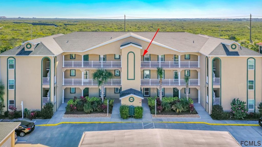 This third-floor condo welcomes you into an airy, coastal - Beach Condo for sale in New Smyrna Beach, Florida on Beachhouse.com