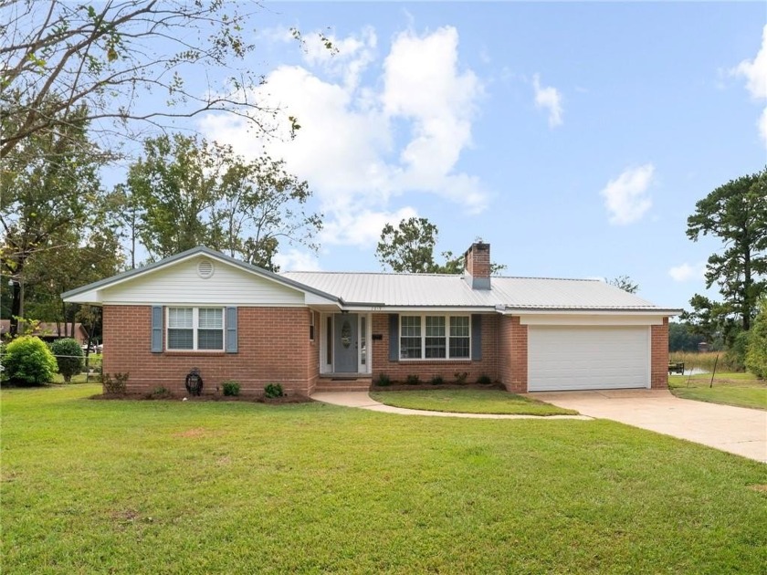 This updated 3-bedroom, 2-bathroom brick home offers the perfect - Beach Home for sale in Mobile, Alabama on Beachhouse.com