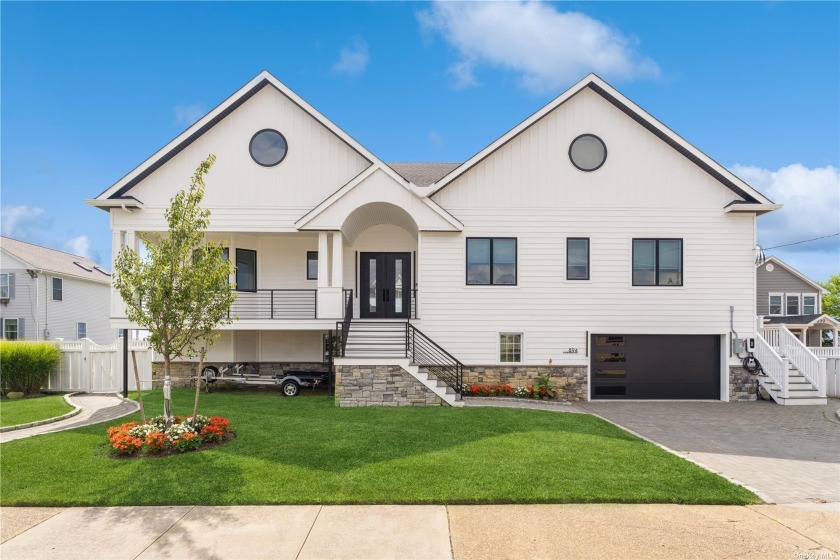 This Modern Luxury Home is a Three-Level Masterpiece Nestled - Beach Home for sale in Freeport, New York on Beachhouse.com