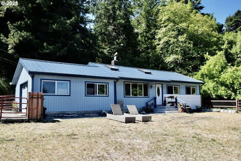 Welcome to this charming single-story home, offering comfort and - Beach Home for sale in Gold Beach, Oregon on Beachhouse.com