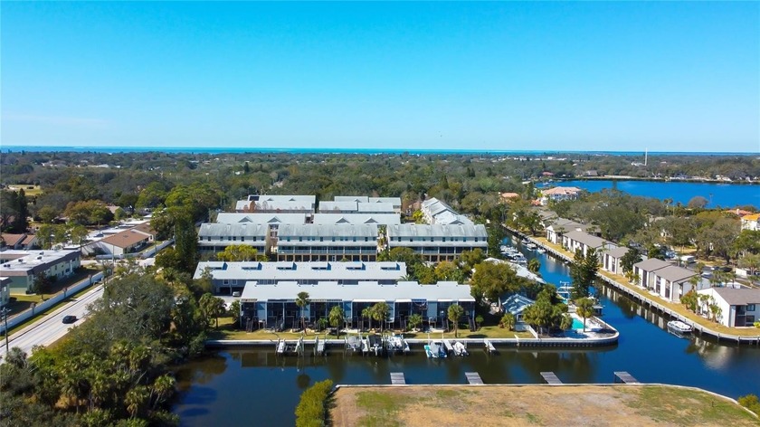 Discover a one-of-a-kind 4-Story WATERFRONT TOWNHOME with DEEDED - Beach Townhome/Townhouse for sale in Tarpon Springs, Florida on Beachhouse.com