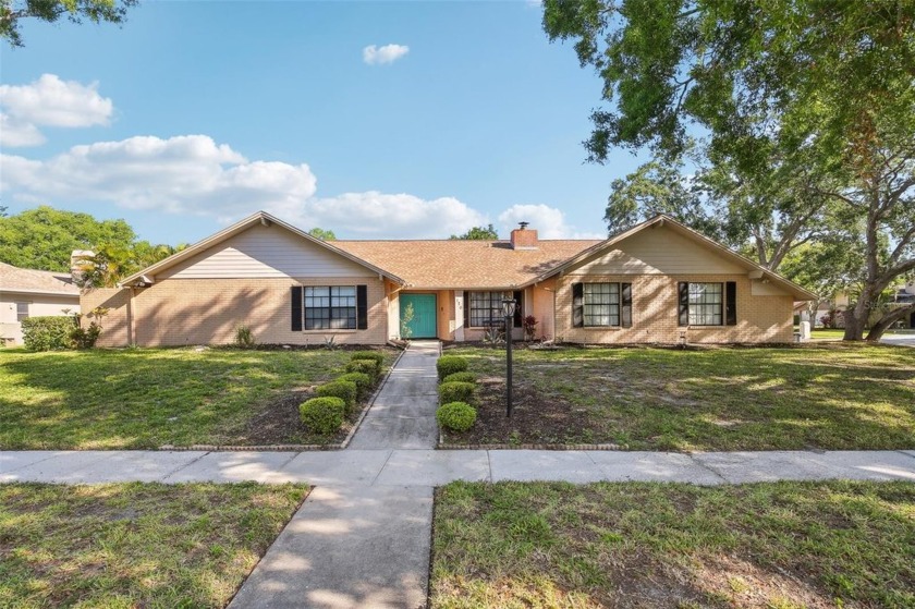 Welcome to this Beautiful Corner-Lot Ranch-Style Pool Home in - Beach Home for sale in Oldsmar, Florida on Beachhouse.com