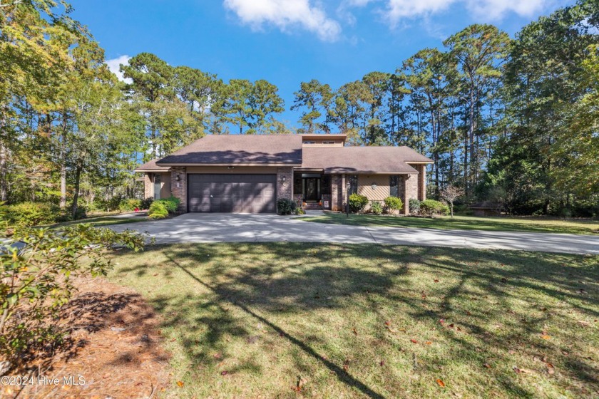 Beautiful custom-built coastal retreat that offers rare privacy - Beach Home for sale in Calabash, North Carolina on Beachhouse.com