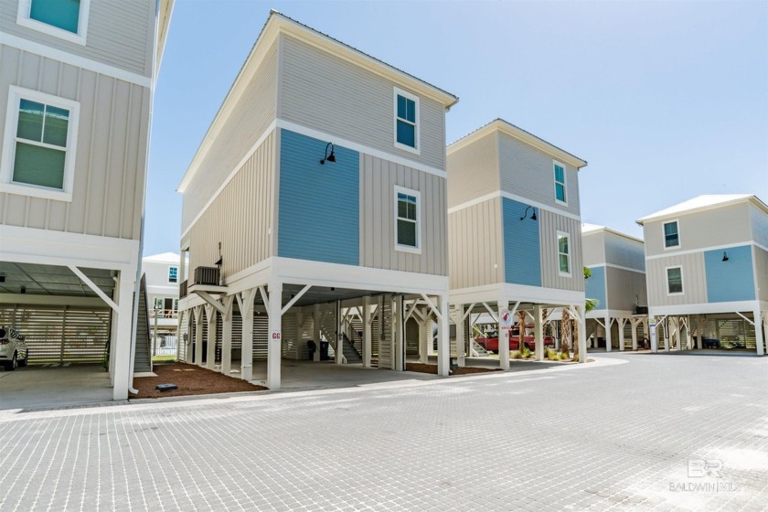 Coastal charm meets modern comfort in this stunning 4-bedroom - Beach Condo for sale in Gulf Shores, Alabama on Beachhouse.com