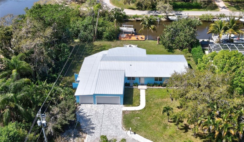 Assumable mortgage 4.5%. NEW METAL ROOF Dec 2023! Canal front - Beach Home for sale in Vero Beach, Florida on Beachhouse.com