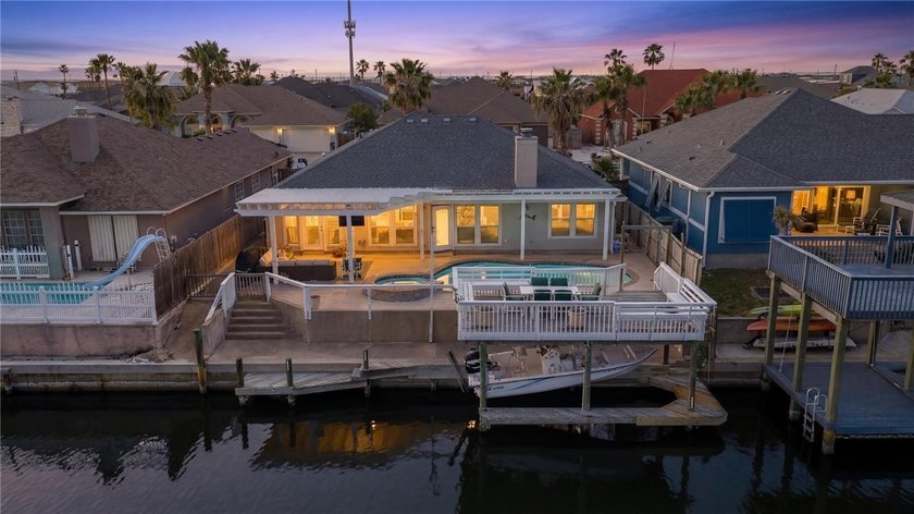 Island living done right...WATERFRONT + POOL...This 3-bedroom - Beach Home for sale in Corpus Christi, Texas on Beachhouse.com