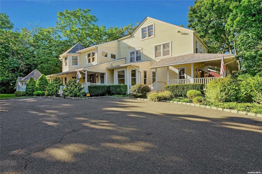 Charming Colonial farmhouse situated on 0.87 acres in the heart - Beach Home for sale in Centerport, New York on Beachhouse.com