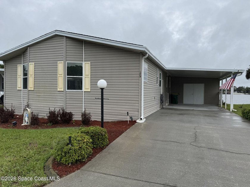 Rarely available lakefront property! This 2-bedroom, 2-bath home - Beach Home for sale in Cocoa, Florida on Beachhouse.com