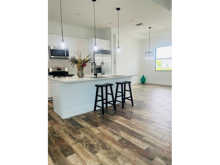 This beautiful 3-bedroom plus den new construction is located in - Beach Home for sale in Port Charlotte, Florida on Beachhouse.com