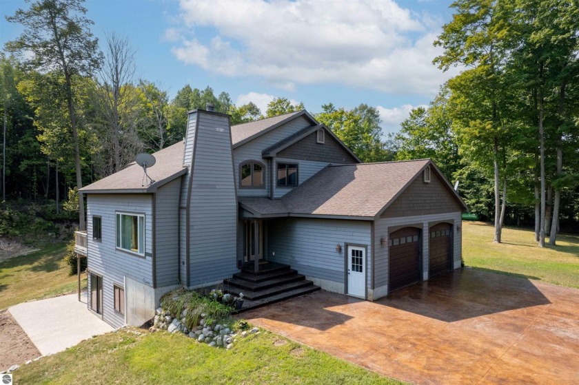 Spacious home with large acreage in picturesque Davis Lake - Beach Home for sale in Maple City, Michigan on Beachhouse.com