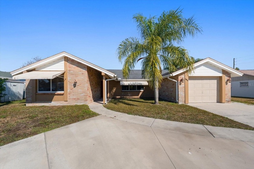 Step into this beautifully remodeled waterfront home, where - Beach Home for sale in New Port Richey, Florida on Beachhouse.com