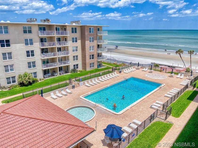 Beach living is easy when all you need is to pack your swimsuit - Beach Condo for sale in New Smyrna Beach, Florida on Beachhouse.com