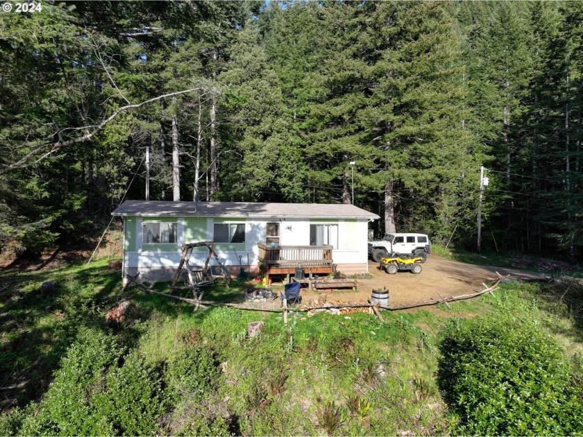 Views of the rugged coastline & the Pacific Ocean abound, yet - Beach Home for sale in Brookings, Oregon on Beachhouse.com