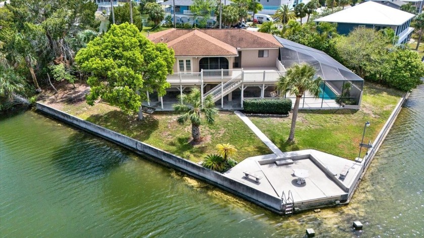 Welcome to this inviting waterfront property located in the - Beach Home for sale in Hernando Beach, Florida on Beachhouse.com