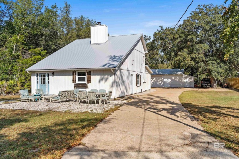 This two-story home sits on approximately 3/4 acre in the highly - Beach Home for sale in Orange Beach, Alabama on Beachhouse.com