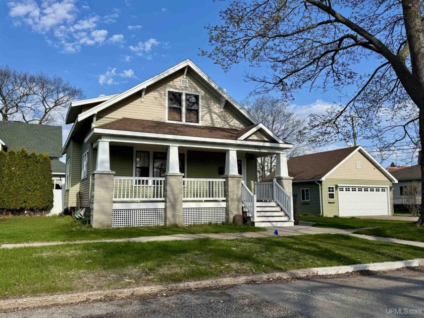 Step inside this charming Craftsman style home just minutes from - Beach Home for sale in Escanaba, Michigan on Beachhouse.com