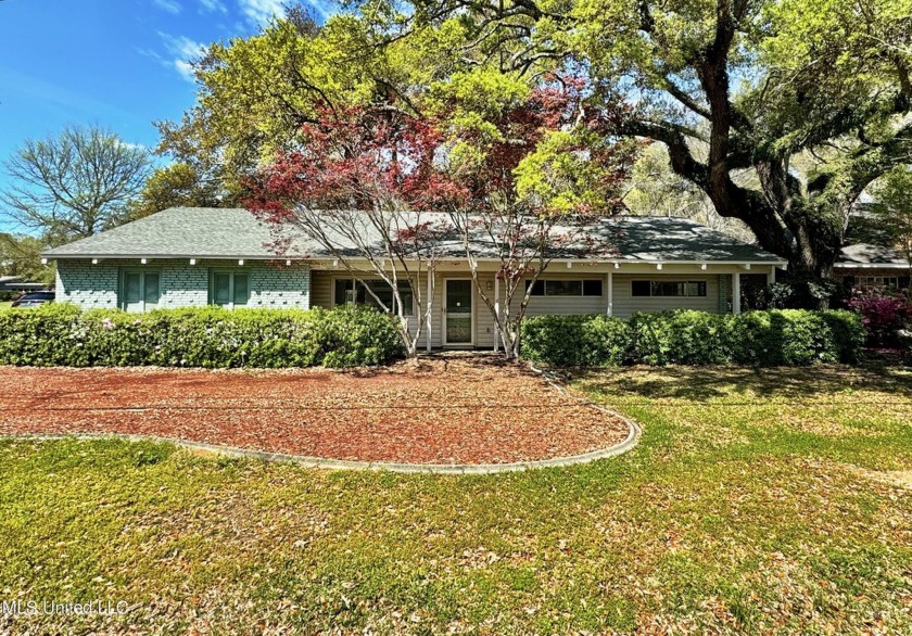 This charming golf course home nestled among live oak trees by a - Beach Home for sale in Diamondhead, Mississippi on Beachhouse.com