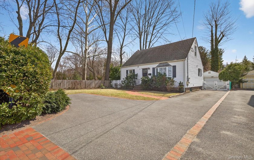 Enjoy water views of Mill Pond from this well-maintained and - Beach Home for sale in Port Washington, New York on Beachhouse.com