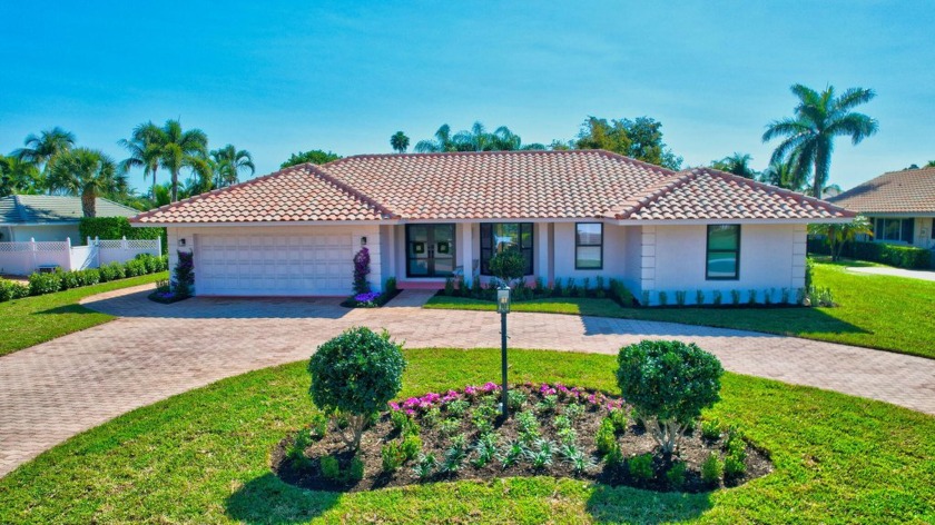 Nestled in the exclusive gated Delray Dunes Country Club, this - Beach Home for sale in Boynton Beach, Florida on Beachhouse.com